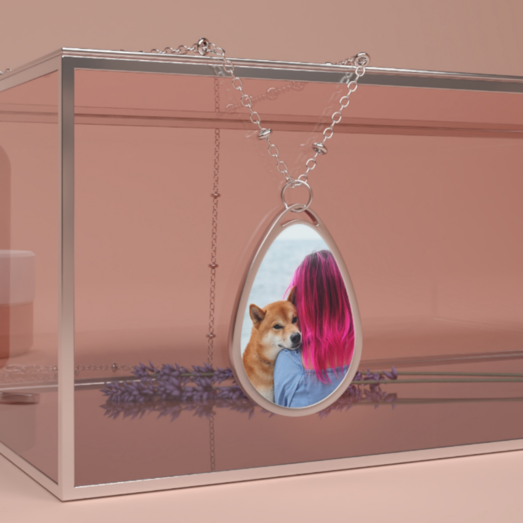 Custom jewelry A custom necklace with a print of a dog and its owner.